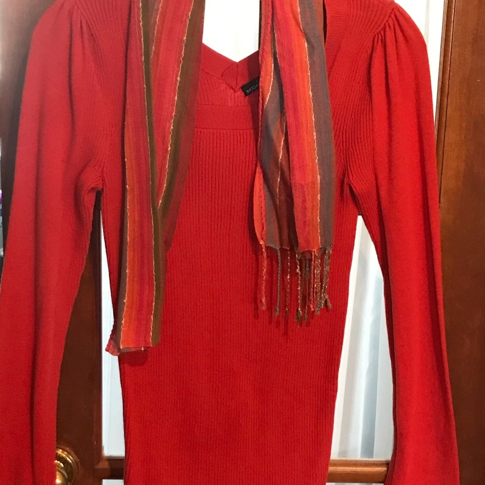 Colorful and smart looking scarves are in and look what a nice sweater to match.